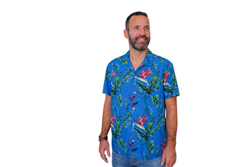 Happy man wearing a colorful aloha shirt with floral pattern, feeling relaxed and leisure, ready for summer holidays © Komora