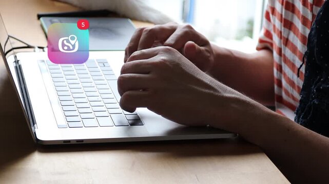Casual Asian man hands typing on a laptop computer keyboard, featuring a 3D tracked university graduation mortarboard hat education notification pop up and red counter.