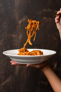 Delicious pasta twirled on fork
