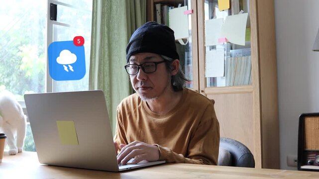 A mature Asian man with long white hair and glasses typing on a laptop at home, featuring a 3D tracked weather storm cloud lightning thunder notification pop up and red counter.