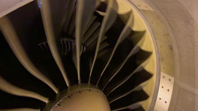 Close Up Perspective of Commercial Jetliner Turbofan Engine Blades with Spinner Nose Cone Demonstrating Advanced Aviation Propulsion Technology