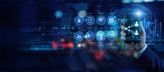 Fototapeta premium Network manager holding a mobile phone analyzing global Connection and Sharing data on a holographic world map. Futuristic technology, secure network connections, and advanced data visualization.