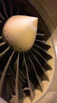 Close up perspective of aircraft turbine fan blade rotation high bypass turbofan engine details commercial airplane heavy maintenance preflight inspection process concept 4k footage
