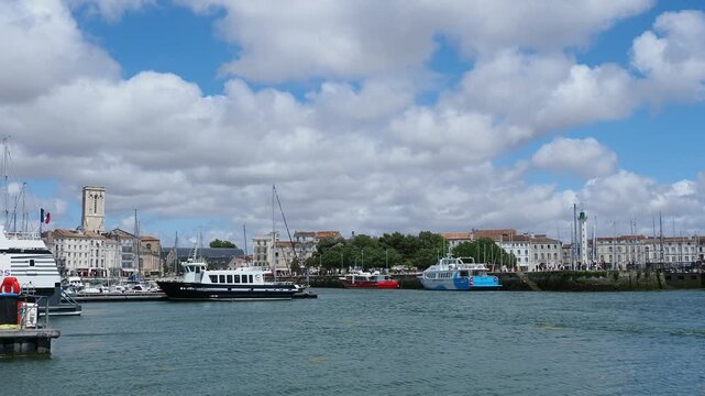 La Rochelle, maritime city face au Bay of Biscay. Yachts Basin, surrounded by the Quais Valin and Quai Amiral Meyer, the square with view of the Church of Saint Sauveur and the Green Lighthouse
