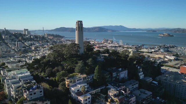 Cinematic drone footage orbiting around Coit Tower on Telegraph Hill in San Francisco. Smooth aerial movement showcasing the iconic Art Deco landmark.