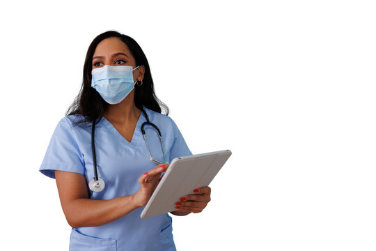 Female healthcare professional wearing a medical mask and scrubs, using a digital tablet for patient care, transparent background