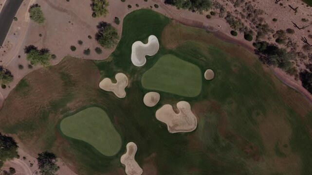 A HD aerial view of a desert golf course located in southeastern Arizona in the summer.