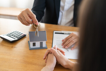 Naklejka na ściany i meble Close up agent giving a key to new owner or tenant, client after signed signature contract rental purchase, buyer apartment, home with landlord, realtor. Banker agreement mortgage loan. Property lease