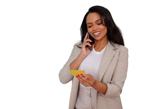 Woman making phone call while holding credit card, doing online shopping and secure mobile payment