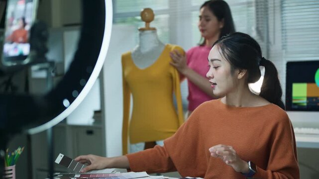 Asian Female Fashion Influencer Live Streaming with Ring Light and Mannequin in Studio
