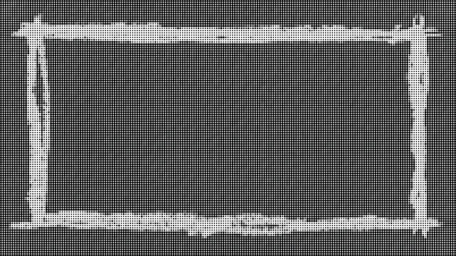 A close-up view of a rectangular object with a rough edge on a flat surface