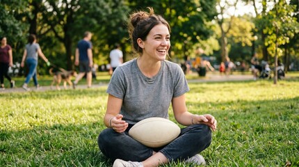 Obraz premium Young Woman Sitting on Grass in Park Holding American Football Smiling Happily Minimalist American Football