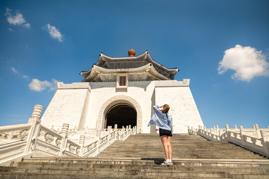 Woman on steps of Chiang Kai-shek Memorial Hall