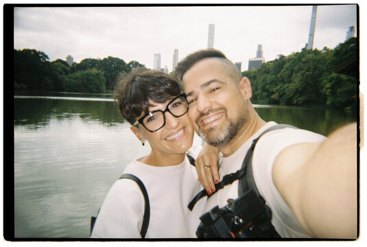 Couple traveling taking selfie in Central Park, New York City