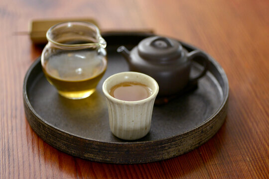 Closeup of traditional Chinese tea ware and tea on the dining table