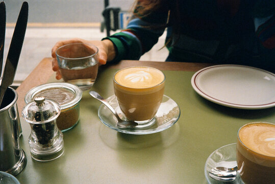 Anonymous person enjoying a cup of coffee in London
