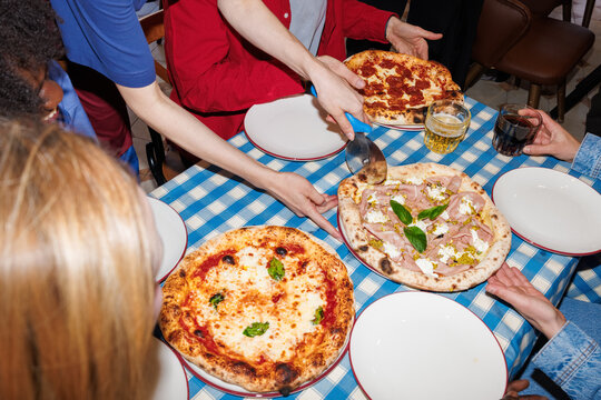 Serving pizza