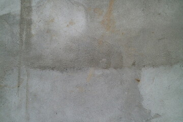 Rough gray concrete wall texture suitable for industrial design projects, architectural presentations, urban backgrounds, construction business concepts, and textures. © Dinamartina93