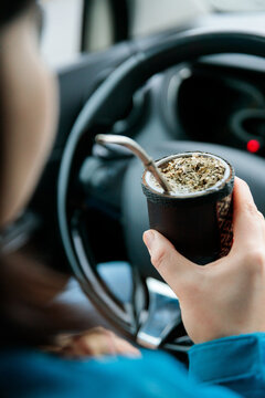 Driver holding mate drink
