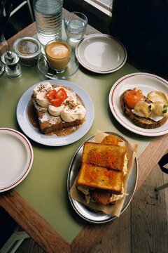 Avocado Toast with Poached Egg and Hollandaise Sauce at Brunch Cafe