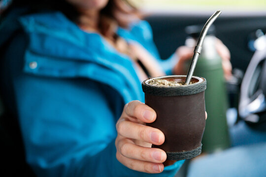 Woman holding traditional mate