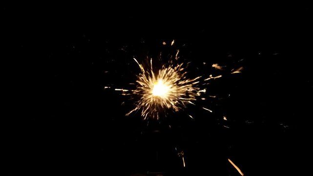 Glowing light, radiating outward against a dark background, in a starburst pattern