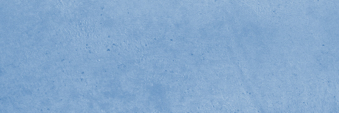Solid light blue texture with speckled mottled matte finish is suitable for backgrounds, design projects, and artistic creations. Smooth painterly azure backdrop.