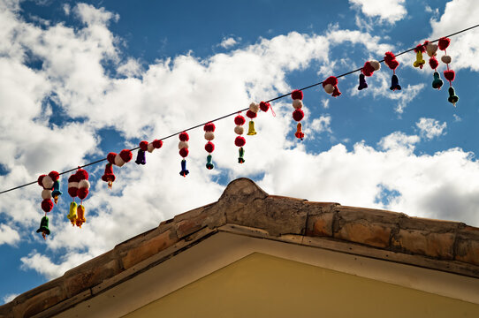 Colorful pompom strings in Ollantaytambo in the Sacred Valley near Cusco in Peru.