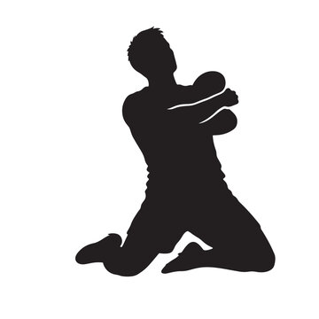 Silhouette of a male athlete kneeling with crossed arms celebrating victory or emotional achievement