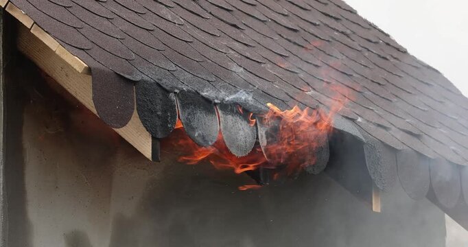 A 4K movie with a miniature house burns in a controlled manner to observe the behavior of different materials and untreated wood against fires.