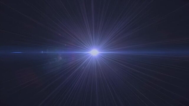 A bright blueish-white light source with intense lens flare radiating outwards in a dark environment.