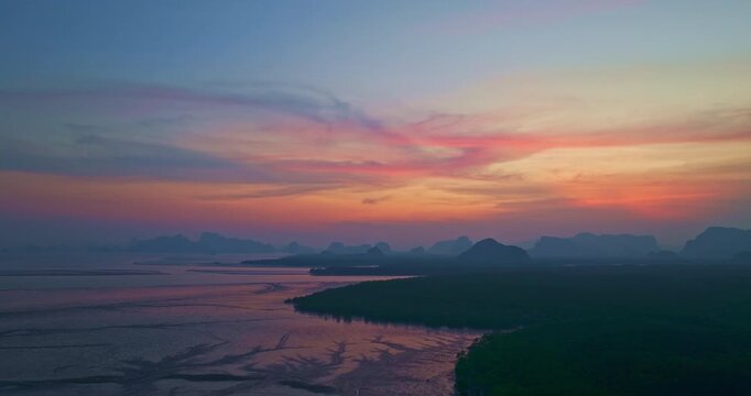 Sunset above Amazing a fishing village that lives on a small, isolated island. mangrove forests on the back. In front is a canal that leads to the sea. Landmark of seafood it is cheap and fresh.