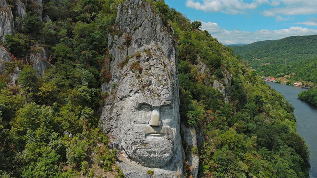 Statue of ancient dacian king Decebal on Danube river