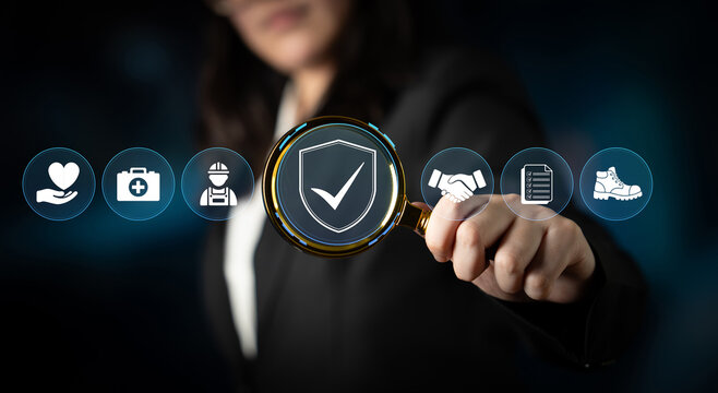 Businesswoman Holding Magnifying Glass with Shield Symbol for Security in Digital or Physical Workplace Protection. Glyphic.