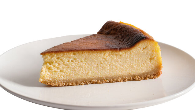 Isolated a delicious slice of rich and creamy Basque burnt cheesecake dessert on a plate