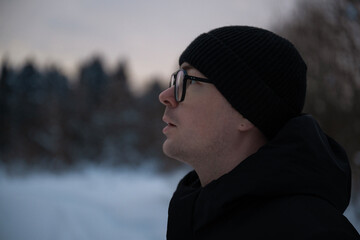 Close Up Portrait of Thoughtful Man in Winter Landscape © Pavel