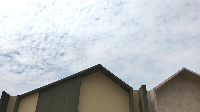 Subsidized housing that is closely arranged with the same size. Side view of subsidized housing development in Central Java, Indonesia - 06.21.2026.