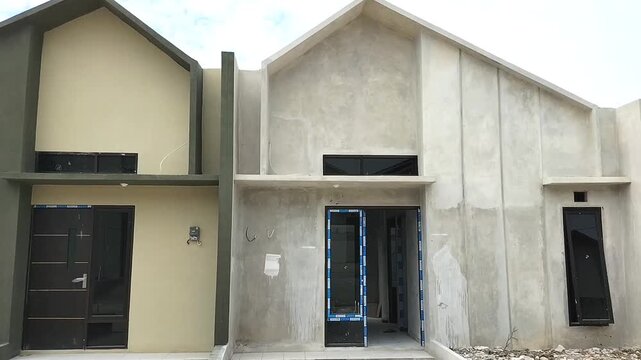 Subsidized housing that is closely arranged with the same size. Side view of subsidized housing development in Central Java, Indonesia - 06.21.2026.