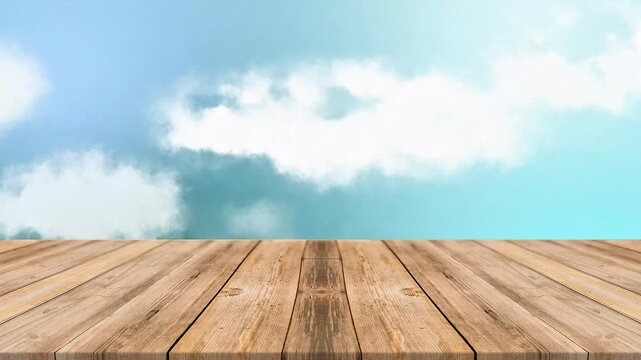 Empty wooden table top with blurred blue sky and white clouds background for product display, montage or mockup