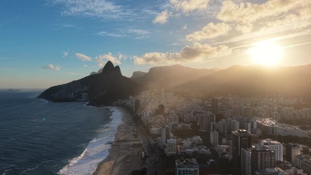 Ipanema, Rio de Janeiro, golden hour, sunset, dusk, late afternoon, beach, ocean, sea, coastline, shoreline, waves, skyline, buildings, apartment buildings, urban beach, beachfront, residential towers