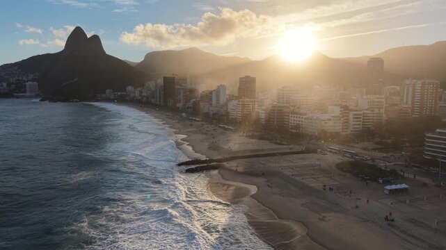 Ipanema, Rio de Janeiro, golden hour, sunset, dusk, late afternoon, beach, ocean, sea, coastline, shoreline, waves, skyline, buildings, apartment buildings, urban beach, beachfront, residential towers