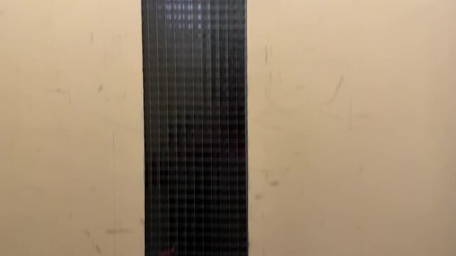 Old elevator moving up between floors, vintage lift interior detail, second floor