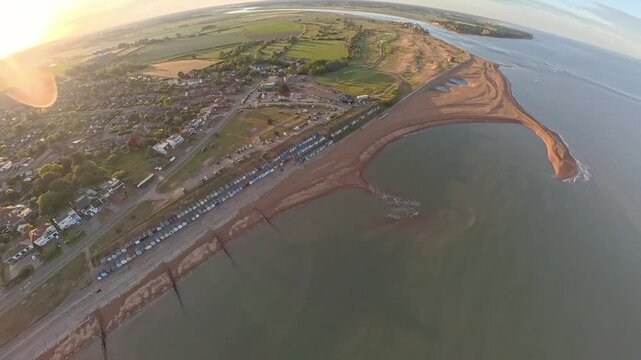 4K Drone Aerial View: Old Felixstowe Seafront and Shingle Beach at Golden Hour
