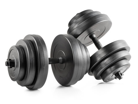 Black adjustable dumbbells with stacked weight plates isolated on white background. Fitness equipment, home gym and strength training concepts.