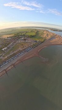 9:16 Vertical 4K Drone Aerial: Old Felixstowe Seafront and Shingle Beach at Sunset