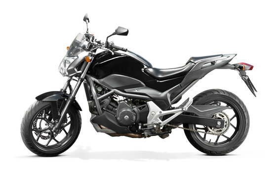 Black street motorcycle isolated on white. Side view with turned stear