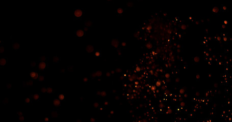 Glowing embers and fire particles drifting through dark background. Atmospheric cinematic effect ideal for compositing, motion graphics, visual effects and video production. © Jag_cz