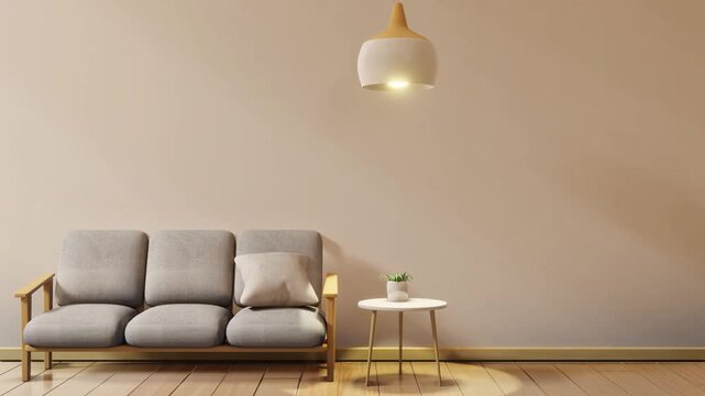 Modern minimalist living room interior with a grey sofa, a small side table with a plant, and a pendant lamp against a beige wall