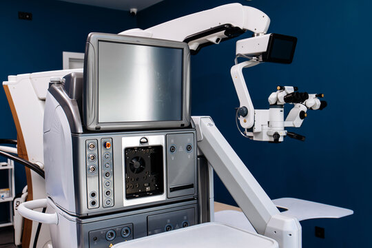 Surgical system for eye operations featuring advanced technology with monitor, control panel, and precision instruments in a modern medical environment