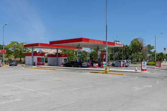 Lagoa Algarve Modern Auchan gas station with cars refueling under a bright blue sky